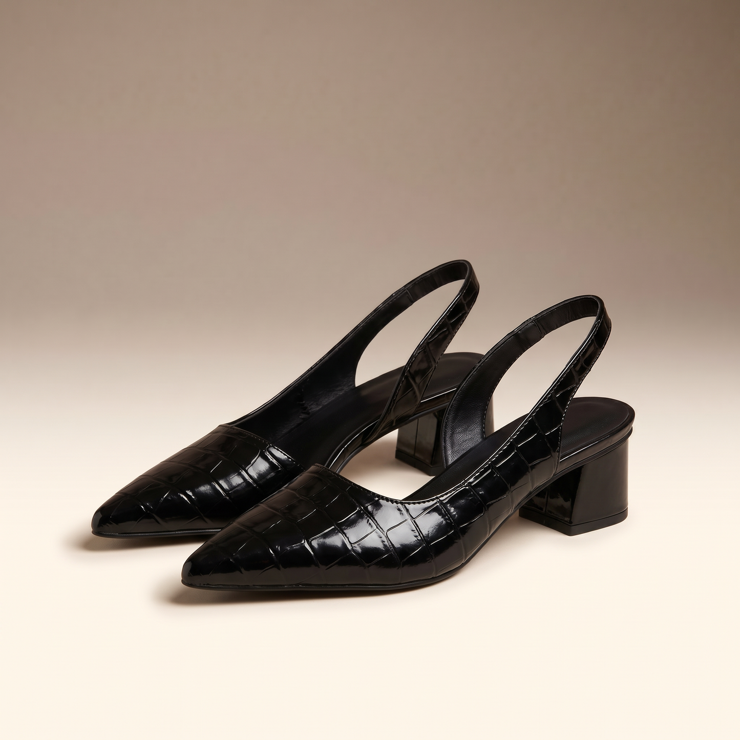 ront view of Solène black pointed-toe slingback block heel pumps