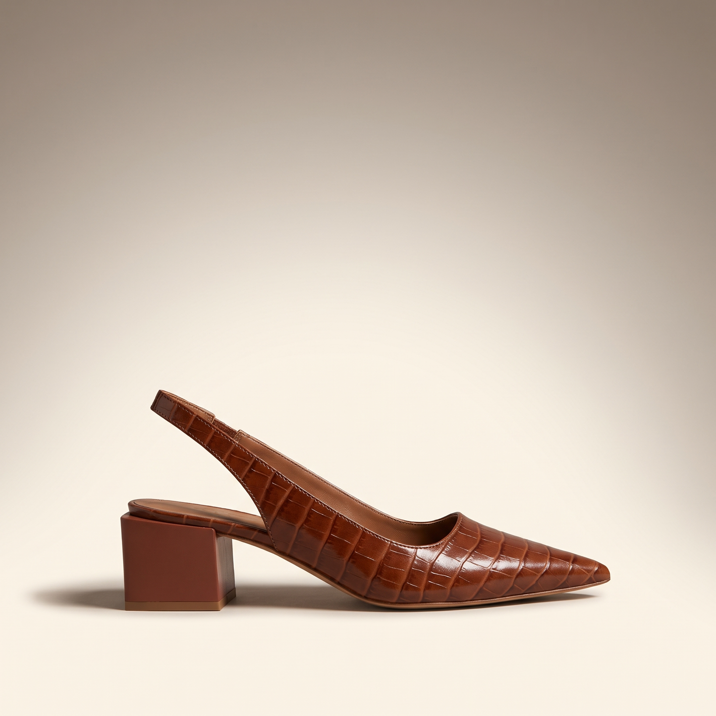Side profile of Solène brown croc slingback heels showing the block heel